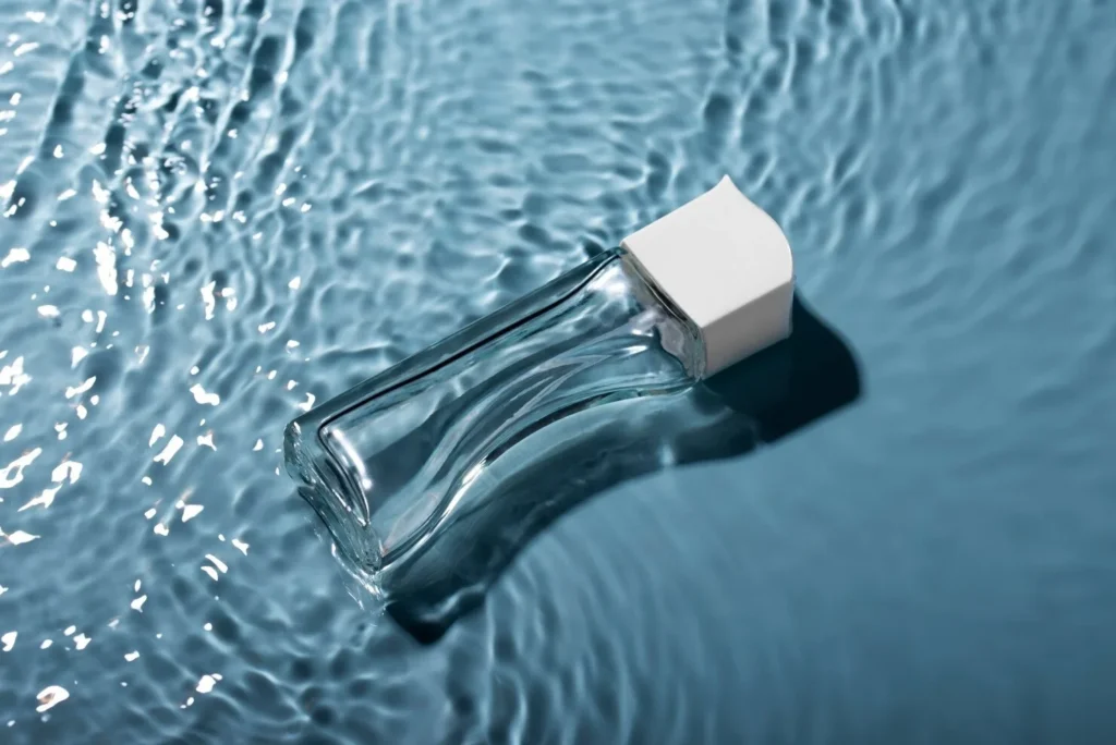 close up perfume floating water