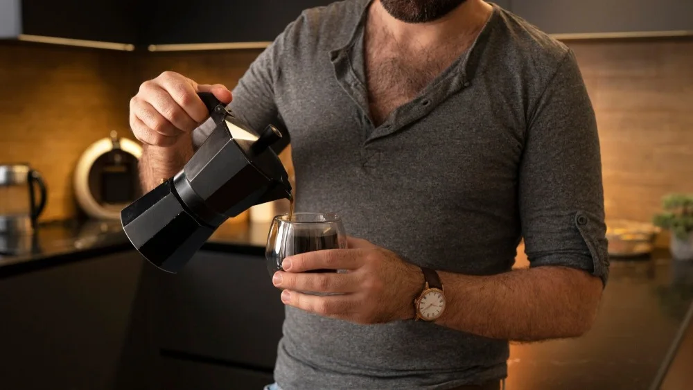 man pouring coffee