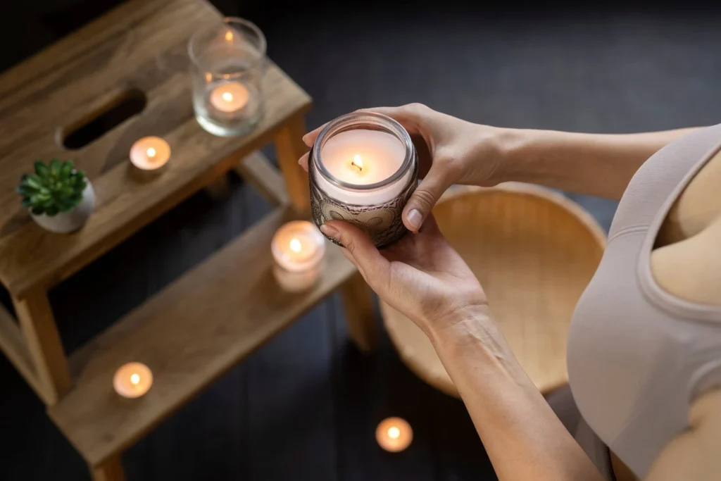 woman holding candle high angle